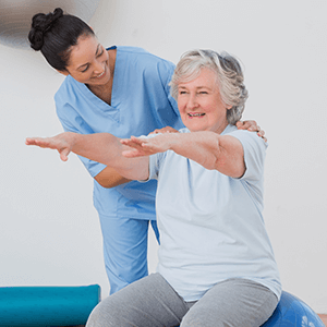 Rehabilitation Therapy - Therapist works on Physical Therapy with Senior Woman